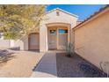 Inviting front entrance with a cozy porch, desert landscaping and well maintained doorway at 1807 W Canary Way, Chandler, AZ 85286