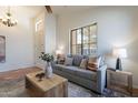 Cozy living room with large window, comfortable seating, and stylish decor, perfect for relaxation at 1807 W Canary Way, Chandler, AZ 85286