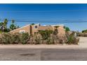 Charming exterior view with desert landscaping and mature trees at 1953 E Presidio Rd, Phoenix, AZ 85022