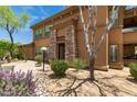 Charming two-story home with stucco exterior and stone accents, featuring a welcoming front entrance at 19700 N 76Th St # 1040, Scottsdale, AZ 85255