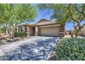 Beautiful single-Gathering home boasting a well-maintained lawn and an attached two-car garage at 23781 W Mohave St, Buckeye, AZ 85326