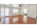 Bright bedroom with hardwood floors, large windows, and an ensuite bathroom, offering a private retreat at 238 W Myrna Ln, Tempe, AZ 85284