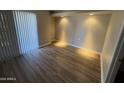 Inviting bedroom boasts wood floors, a bright window, and a cozy, comfortable atmosphere at 3434 W Danbury Dr # A206, Phoenix, AZ 85053