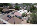 Aerial view of a cozy home showcasing its red tile roof and proximity to neighboring residences at 42 E 2Nd Ave, Mesa, AZ 85210