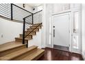 Modern wood staircase showcasing black iron railings and leading to an upper floor at 4434 E Camelback Rd # 132, Phoenix, AZ 85018