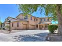 Charming two-story house featuring a stucco exterior, three-car garage, and well-kept front yard at 45113 W Buckhorn Trl, Maricopa, AZ 85139