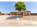 Charming single-story home with a two-car garage, mature landscaping, and a welcoming front yard at 4712 W Juniper Ave, Glendale, AZ 85306