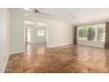 Spacious living room with tile flooring and large windows, offering a bright and open atmosphere at 606 W 15Th St, Tempe, AZ 85281