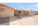 Covered patio featuring a ceiling fan and ample space for outdoor furniture, perfect for dining or relaxing at 636 S Rosemont --, Mesa, AZ 85206