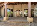 Inviting home entrance with a beautiful stone walkway and a covered porch at 7731 E Soaring Eagle Way, Scottsdale, AZ 85266