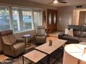 Cozy living room featuring a double door entry, comfortable seating, and large windows at 8355 E Via De Encanto --, Scottsdale, AZ 85258