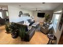 Spacious living room featuring a sectional sofa, plush seating, and decorative accents at 8355 E Via De Encanto --, Scottsdale, AZ 85258