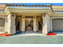 Charming building entrance with red accents and well maintained stairs at 8653 E Royal Palm Rd # 1030, Scottsdale, AZ 85258