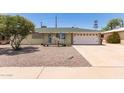 Charming single-story home featuring low-maintenance desert landscaping and a one-car garage at 1308 N 66Th St, Scottsdale, AZ 85257