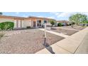 Charming single-level home with a xeriscaped front yard and a welcoming entrance at 13428 N Hawthorn Dr, Sun City, AZ 85351