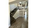 Grand foyer featuring a staircase, wood floors, and chandelier lighting at 16217 N 154Th Dr, Surprise, AZ 85374
