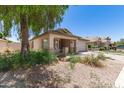 Lovely single-story home showcasing a well-manicured front yard and a two-car garage at 16783 W Taylor St, Goodyear, AZ 85338