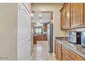 Spacious kitchen featuring stainless steel appliances and ample cabinet space at 1923 N Cocoa Ct, Casa Grande, AZ 85122