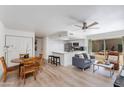 Bright living room featuring wood floors and an open floorplan into the kitchen at 2021 E Osborn Rd # 9, Phoenix, AZ 85016