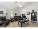 Bright living room boasts tile floors and ample seating with stylish furnishings at 2488 Leisure World --, Mesa, AZ 85206
