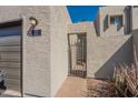 Attractive entryway with private gate, desert landscaping, and a convenient garage at 2524 S El Paradiso -- # 17, Mesa, AZ 85202