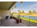 Enjoy serene water views from this brick-paved patio with lush landscaping and palm trees at 2524 S El Paradiso -- # 17, Mesa, AZ 85202