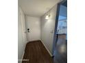 Inviting entryway featuring wood flooring and a view of the kitchen at 4554 E Paradise Village Pkwy # 149, Phoenix, AZ 85032