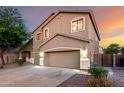 Charming two-story home with a three-car garage, enhanced by landscape lighting at 46065 W Meadows Ln, Maricopa, AZ 85139