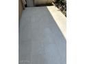 Back patio with large neutral colored tiling at 4701 N 68Th St # 105, Scottsdale, AZ 85251