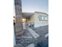 Welcoming manufactured home features a fenced patio, ideal for outdoor dining and relaxation at 5601 W Missouri Ave # 63, Glendale, AZ 85301