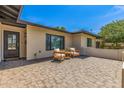 Inviting front patio with comfortable seating, offering a cozy and welcoming entrance to the home at 8119 E San Miguel Ave, Scottsdale, AZ 85250