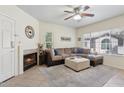 An inviting living room with a plush sectional sofa, fireplace, and elegant decor at 9450 E Becker Ln # 2067, Scottsdale, AZ 85260