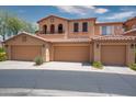 Spacious, three-car garage in light terracotta with a beautiful, covered balcony at 10655 N 9Th St # 112, Phoenix, AZ 85020