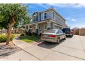 Inviting two-story home with a spacious driveway and a well-manicured front yard, offering curb appeal at 1232 S 120Th Ln, Avondale, AZ 85323