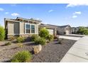 Attractive single-story home with desert landscaping and a spacious two-car garage at 18865 W Mescal St, Surprise, AZ 85388