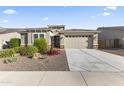 Charming single-story home with a well-maintained yard and two-car garage at 18865 W Mescal St, Surprise, AZ 85388