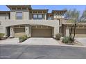Property showcasing a spacious garage and inviting architecture at 19700 N 76Th St # 1103, Scottsdale, AZ 85255