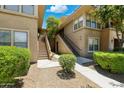 Inviting apartment exterior boasting well-maintained landscaping and convenient stair access to upper-level units at 20100 N 78Th Pl # 2193, Scottsdale, AZ 85255