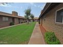 Charming courtyard with mature trees and well-maintained lawns at 2015 E Southern Ave # 23, Tempe, AZ 85282