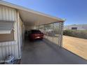 View of the covered parking area, featuring metal support beams and a vehicle at 20644 N 36Th Ave, Glendale, AZ 85308