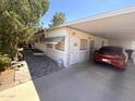 Cozy home with a covered parking area and a paved walkway to the front door at 20644 N 36Th Ave, Glendale, AZ 85308