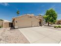 Beautiful exterior showcasing a spacious three-car garage, and well-maintained landscaping at 20961 N 96Th Dr, Peoria, AZ 85382