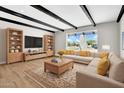 Bright living room featuring modern furniture, stylish decor, and large window views at 2801 E Sunnyside Dr, Phoenix, AZ 85028