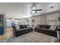 Open-concept living room with a view into the bright, modern kitchen and dining area at 3047 S Mandy St, Mesa, AZ 85212