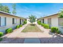 Well-maintained courtyard featuring simple landscaping and walkways at 3324 S Parkside Dr, Tempe, AZ 85282