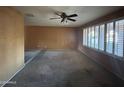 Large living room showcasing neutral walls, carpeting, and ample natural light from windows at 3740 E Mercer Ln, Phoenix, AZ 85028