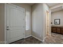 Welcoming entryway with tile flooring, white door, and light-filled window at 3925 E Elmwood St, Mesa, AZ 85205