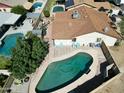 Aerial view showcases the backyard's inground pool and covered patio, perfect for outdoor living and entertaining at 4623 W Solano S Dr # South, Glendale, AZ 85301