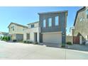 Charming two-story home with a two-car garage and low-maintenance landscaping at 4927 S Tune --, Mesa, AZ 85212