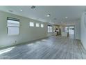 Bright living room with modern tile flooring, recessed lighting and an open floor plan at 4927 S Tune --, Mesa, AZ 85212
